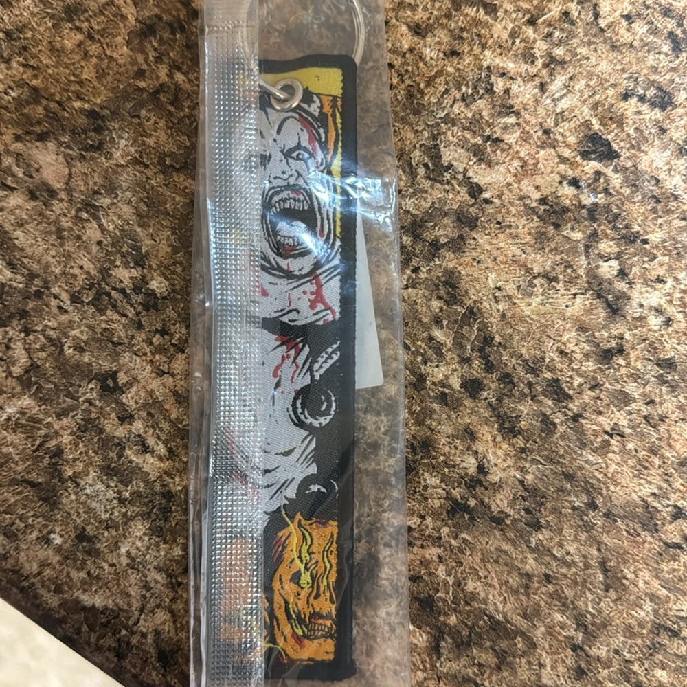New in package - - Terrifier Double Sided Keyc Chain